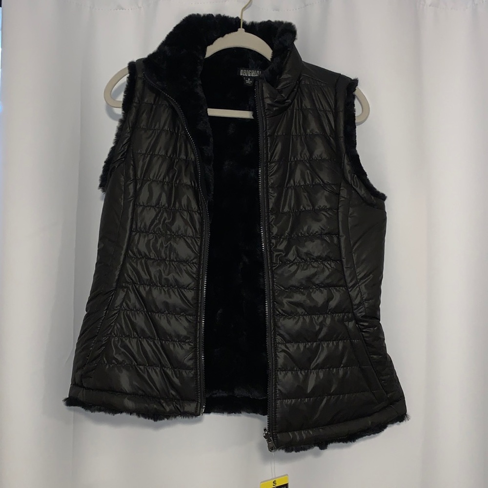 Black vest.